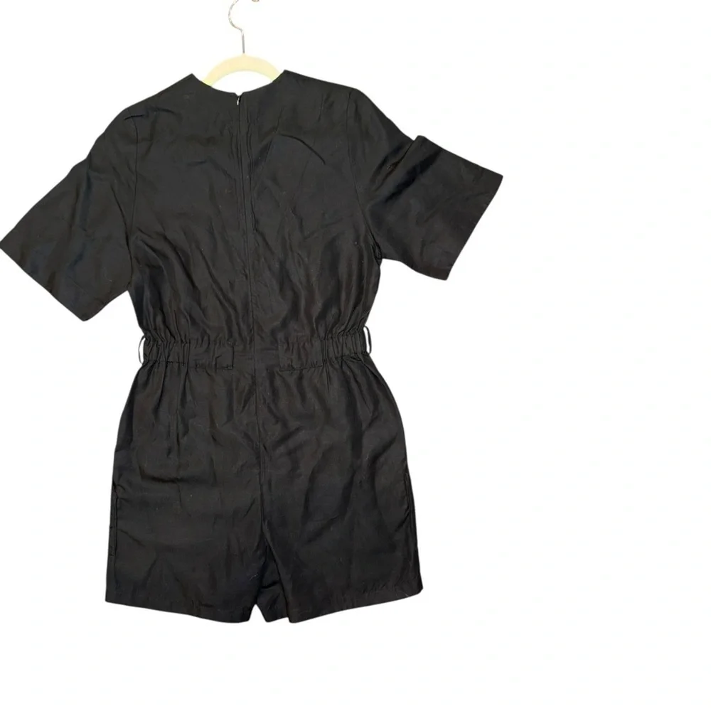 COS v neck belted playsuit 73% TENCEL Lyocell, 22% Linen, 5% Cotton.